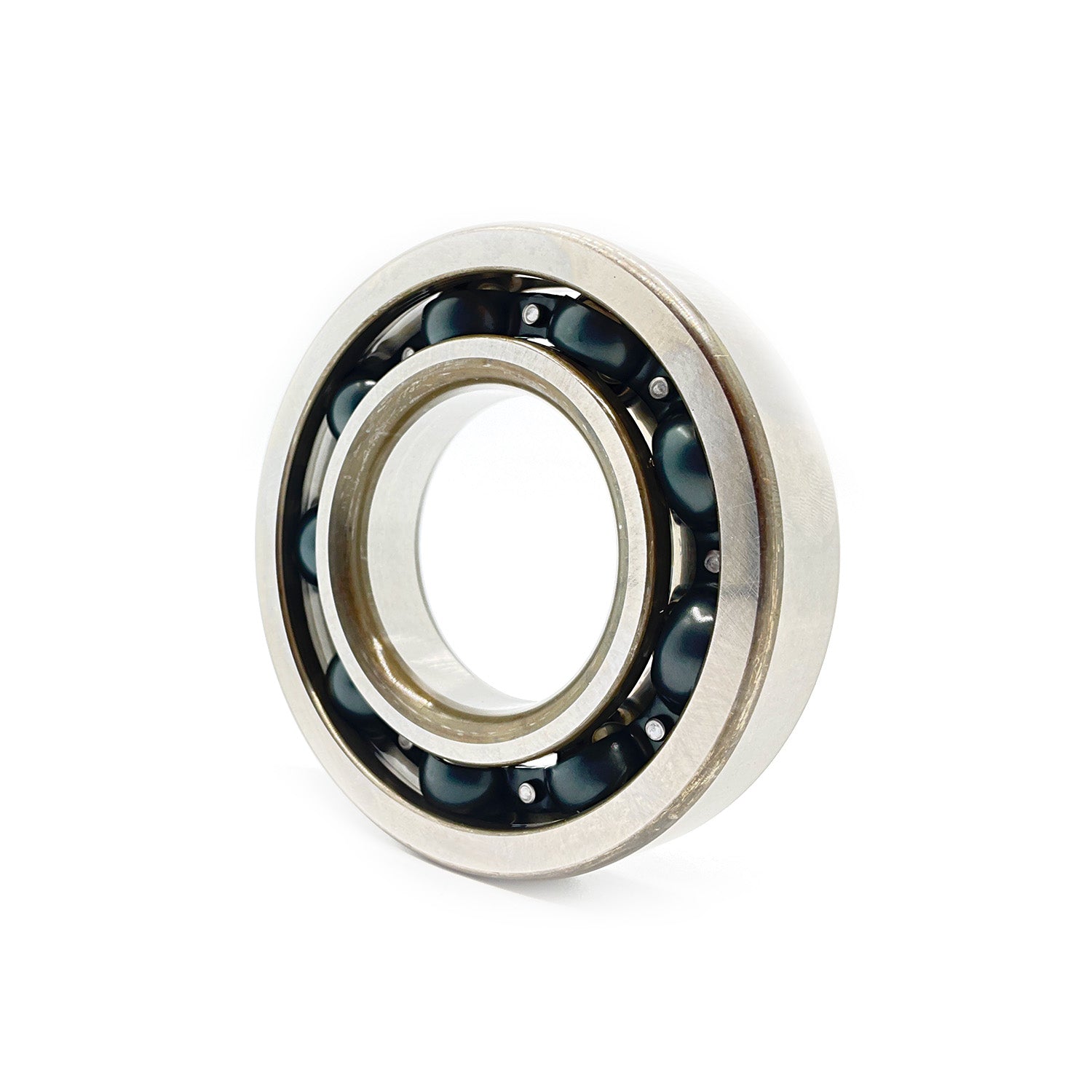 Metal ball bearing with polished steel outer ring and visible black ball bearings inside.