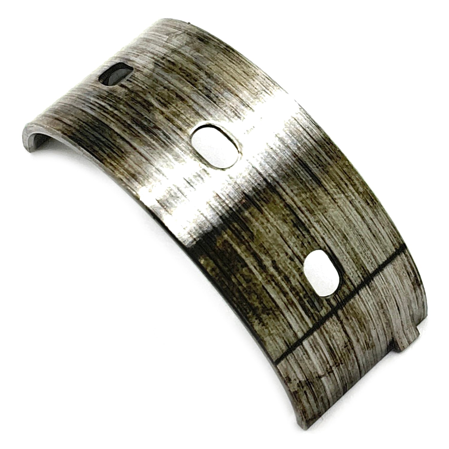 Curved metal balance shaft bearing with three oval holes and a worn silver surface texture.