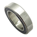 Silver metal steering bearing with black rubber seal ring and smooth inner surface.