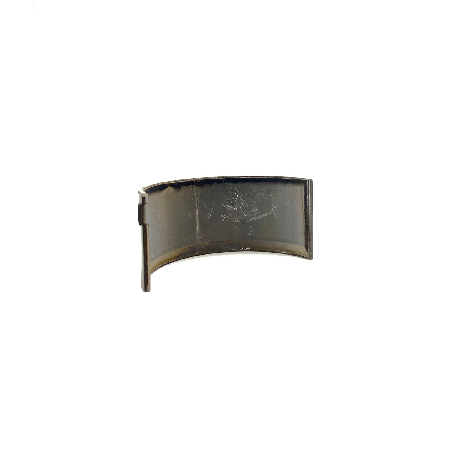 Black curved metal center lower main bearing half with smooth surface and mounting lip.
