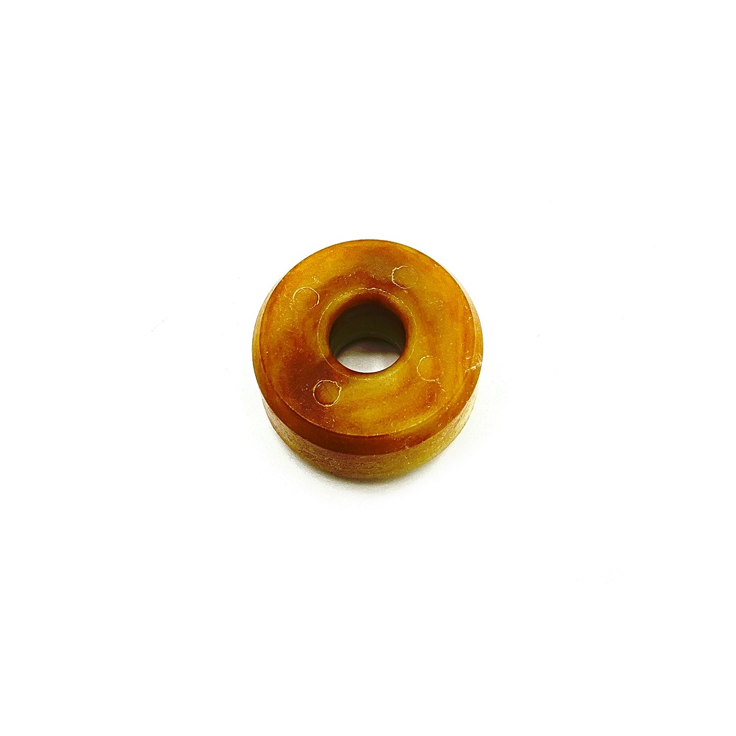 Amber-colored cylindrical roller with central hole, made of smooth plastic material.