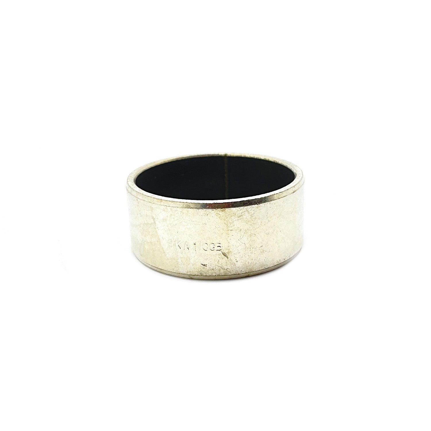 Silver metal cylindrical bushing with smooth inner and outer surfaces, small engraved number on side.