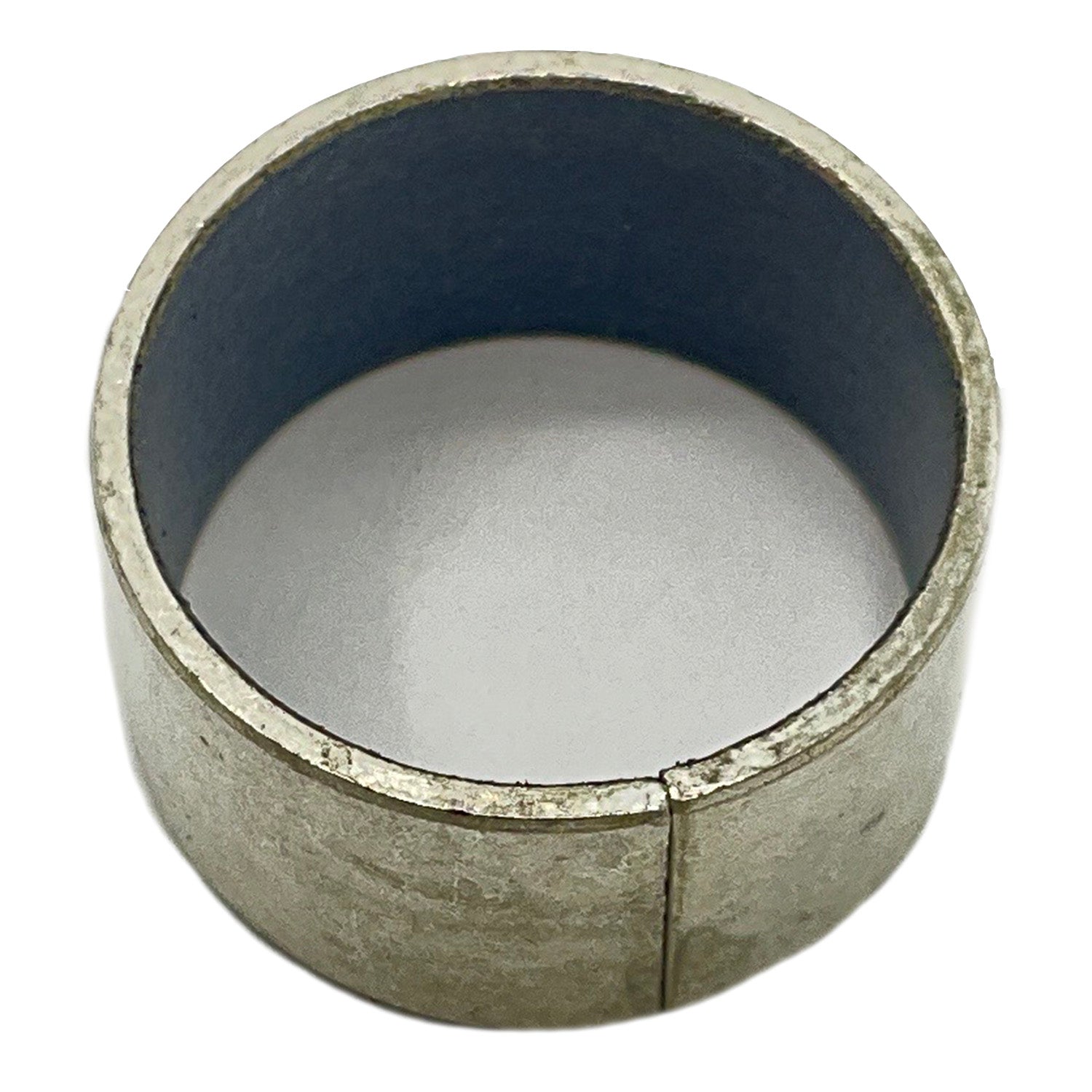 Metal cylindrical bearing with smooth inner surface and a visible seam on the outer edge.