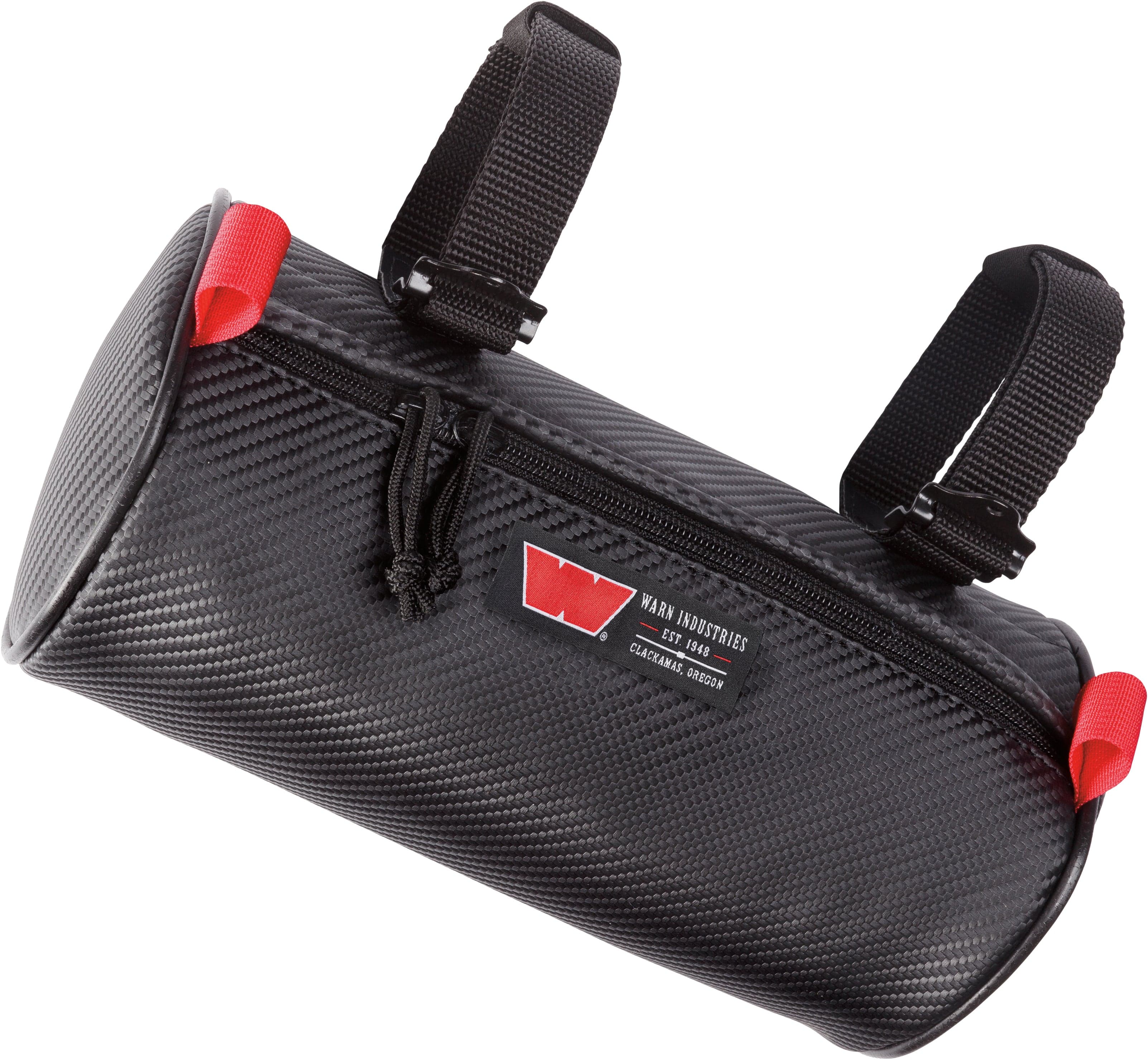 The Roll Bar Cylinder Bag Medium by Warn is a black, water-resistant cylindrical handlebar bag with textured surface, two black attachment straps, red accents, a zipper, and a front logo patch featuring a red W and text.