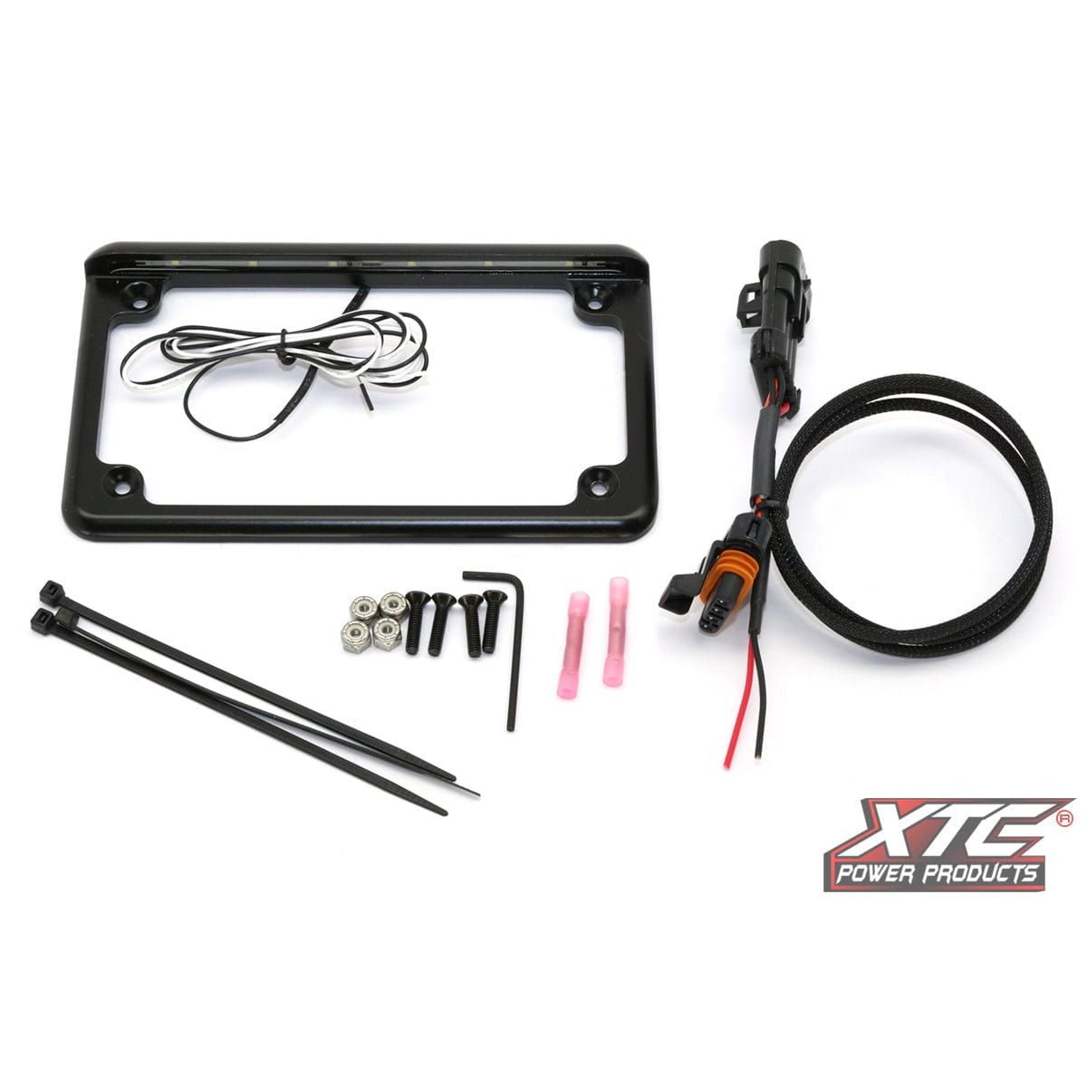 The License Plate w/ LED Pol by XTC Power features a black frame with built-in LEDs, wiring, connectors, screws, wire ties, and the XTC Power Products logo on white. Made in the USA for quality you can trust.