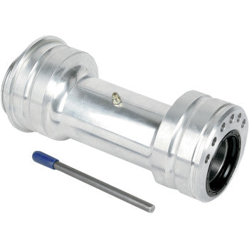 The Axle Carrier Super Twin by Lone Star Racing, a silver cylindrical metal part with flanges, high-load sealed bearings, and a central grease fitting, is shown beside a small metallic rod with a blue handle.