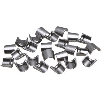 The Keeper Set by Kibblewhite features small, shiny high tensile strength steel retainers arranged in a scattered pattern on a white background.