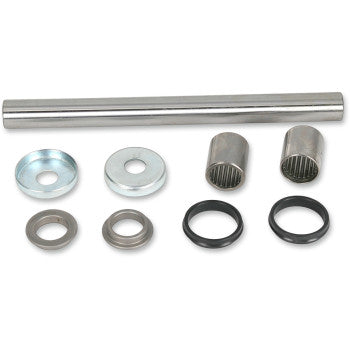 Metal swingarm bearing kit including silver shaft, two cylindrical needle bearings, two shiny metal washers, two smaller.
