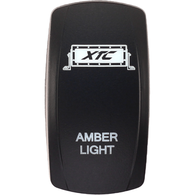 A black rectangular Dash Switch Rocker Face Amber Light Bar by XTC Power with the XTC logo at the top and AMBER LIGHT printed in white below.