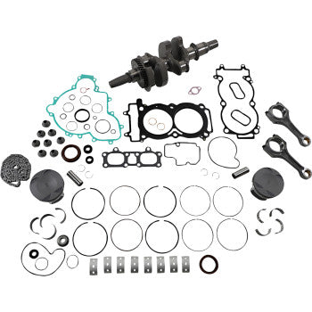 Complete Polaris engine rebuild kit with metal crankshaft, various gaskets, piston rings, bearings, and seals arranged on a.