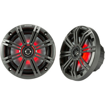 Two black Kicker 6.5" Speakers with a circular design feature 7-color LED lighting behind the grilles and UV resistant materials—one speaker faces forward, while the other is angled to display its depth.