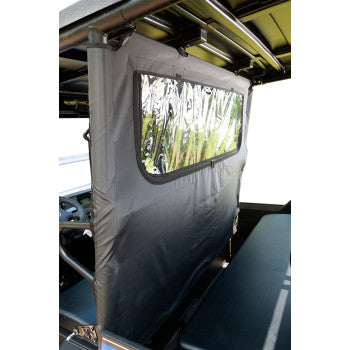 The Seizmik Soft Dust Panel Rear features black fabric and a clear plastic window to separate front and back seats in your Kawasaki UTV, letting sunlight in while adding practical protection to your UTV accessories.