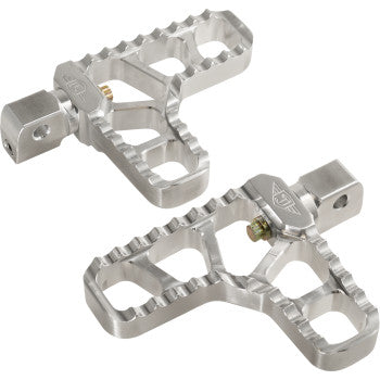 A pair of Indian Serrated Heel Pegs - Silver by Joker Machine with textured, jagged edges and cutout sections, designed for Indian motorcycles, displayed on a white background.