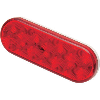 The Brite-Lites Trailer Light Red Lens is an oval, waterproof LED light with multiple circular elements, ideal for trucks or trailers.