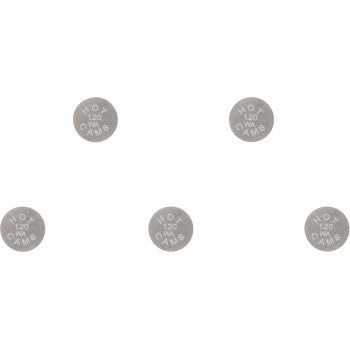 Five small, round metallic valve shims with engraved size markings arranged on a white background.