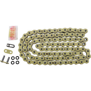 The GB 520 EXW Drive Chain 100 Links by RK is a coiled gold-colored, high-tensile chain for bikes or motorcycles, shown with connecting links, O-rings, and a small lubricant packet on a white background.