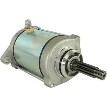 The Starter Motor by Parts Unlimited features a metallic cylindrical body, copper bushings, mounting bracket, and a splined shaft for machine connection, all engineered to meet OEM specifications.