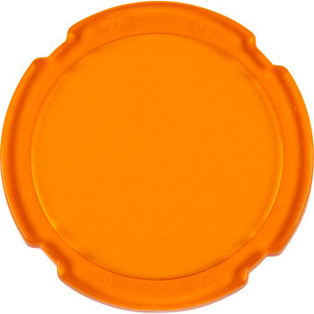 The Lens Amber Spot Light by Heretic is a round, orange plastic lid with four evenly spaced notches around the edge, shown on a white background. Made in the USA.