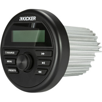 The Bluetooth Media Center Round by Kicker features a black circular design with display, source/menu/preset/playback buttons, and a silver finned heatsink. It offers Bluetooth compatibility for wireless connectivity.