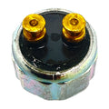 Round metallic pressure switch brake with two gold-colored terminals on black top surface.