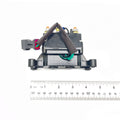 Black plastic and metal Polaris winch contactor with attached wiring and connectors, shown with ruler for scale.