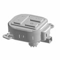 Gray plastic steering wheel module switch with four raised buttons and electrical connector ports.