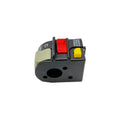 Black plastic ATV handlebar switch with red, yellow, and gray buttons and white labeling.
