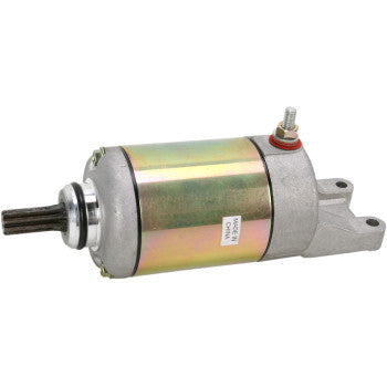 Metallic cylindrical Suzuki starter motor with gear shaft and mounting bracket, silver and gold finish.