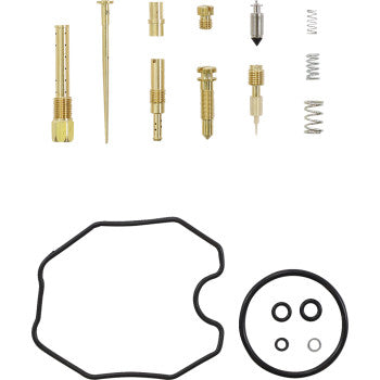 Brass carburetor repair kit components including jets, needle, springs, and black rubber gaskets and seals.