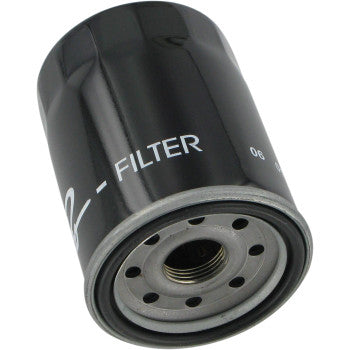 A close-up of the Oil Filter by Parts Unlimited, a black cylindrical filter made from Japanese zinc steel with a threaded metal opening and holes around the center, used for filtering engine oil in vehicles. "FILTER" is partially visible on the side.