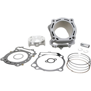 Silver metal cylinder with matching piston, black and gray gaskets, and piston rings arranged separately on white background.
