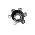 Silver metal bearing cover with six mounting tabs and a central circular opening.
