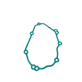 Green irregularly shaped gasket with multiple circular holes around the edges designed for sealing mechanical parts.