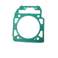 Green rectangular gasket with multiple holes and a large central circular opening, made from a flat sealing material.