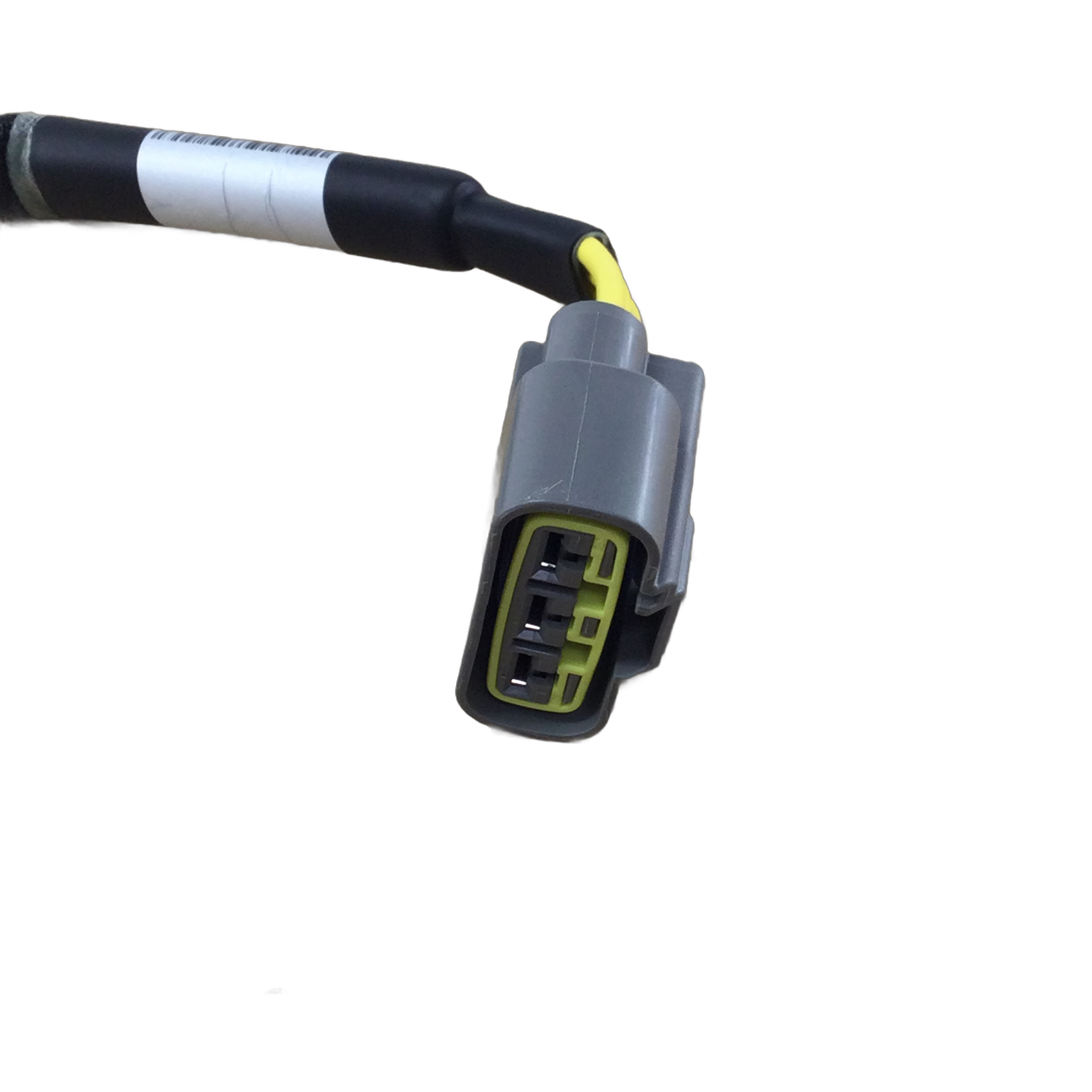 Close-up of a gray electrical wire connector with three metal prongs attached to a black and yellow cable—an essential part for the Can-Am Stator Plate 14V 650W—isolated on a white background.