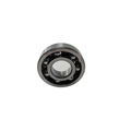 Metal ball bearing with visible steel balls and inner and outer race rings, circular shape.