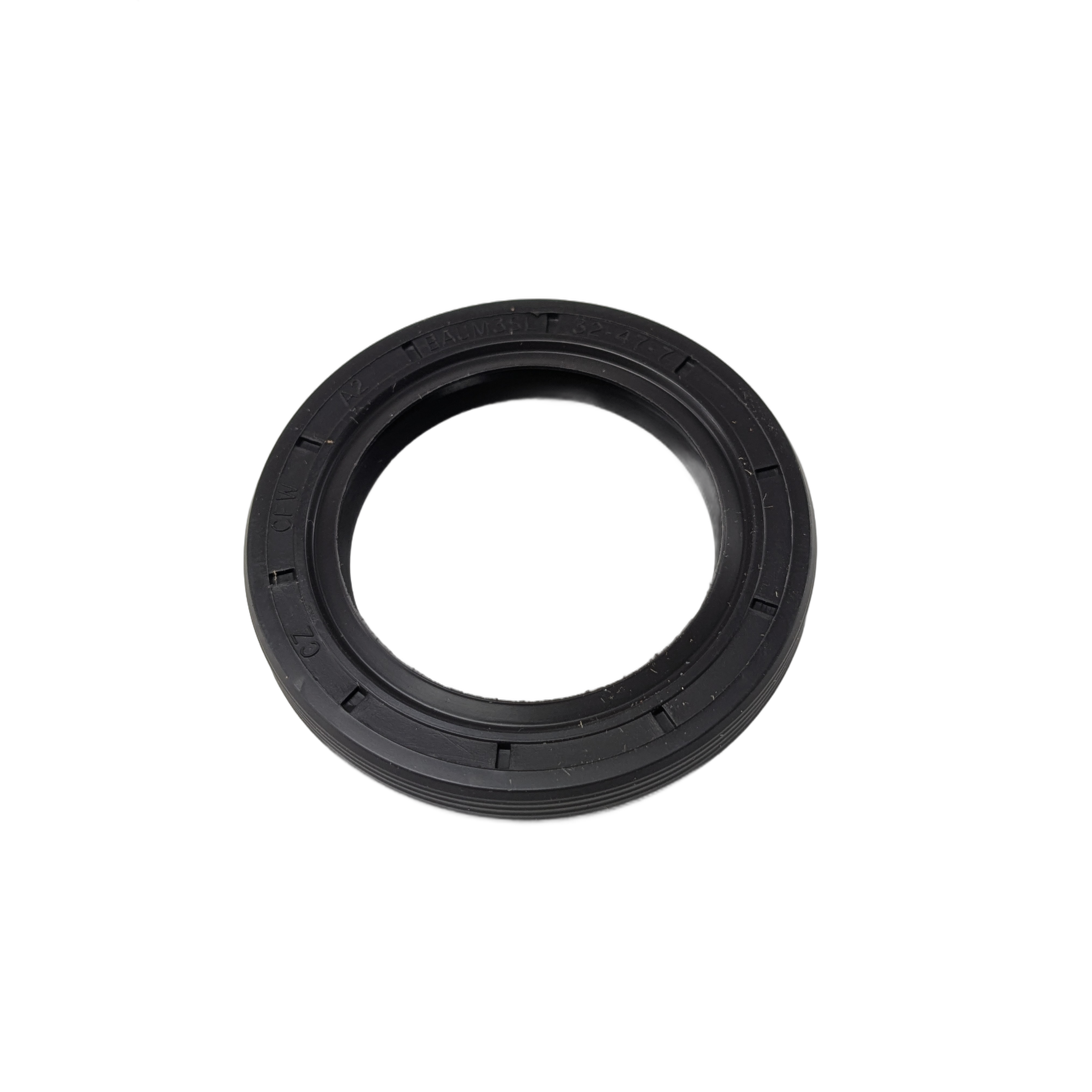 Black rubber oil seal with circular shape and ridged outer edge for automotive use.