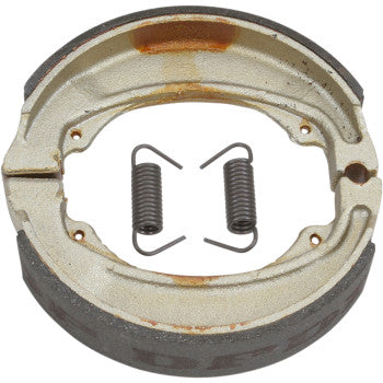 A pair of Honda Brake Shoes by Dp Brakes with a curved design and two coiled metal springs, shown on a plain white background. The shoes exhibit visible wear and some rust.