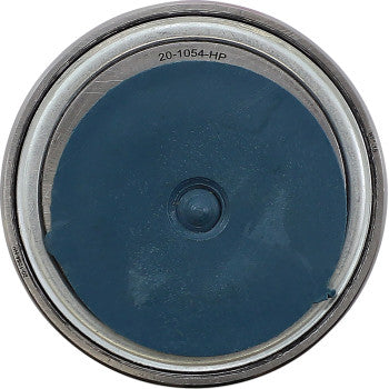 An overhead view of an open paint can with dark blue paint evokes the precision and reliability of the Polaris RZR Wheel Bearing Kit Tapered Double Angular Contact Front by Moose Offroad.