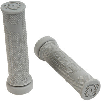 Two gray ATV Hotlap Grips Soft by Torc1, made of Kraton soft rubber with a diamond pattern, feature branding and are ideal for comfortable ATV rides. One grip stands upright while the other lies flat.
