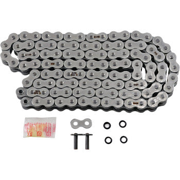 The 525 Max X Drive Chain 110 Links by RK, featuring a coiled O-ring chain, master link, two connecting pins, four rubber O-rings, and lubricant packet, is displayed on a white background.