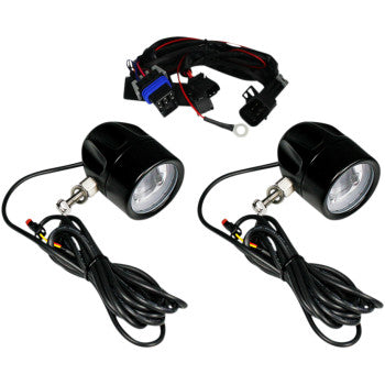 The Indian LED Fog Light - Black by Custom Dynamics includes two round black LED fog lights with attached cables and a wiring harness, featuring Cree LEDs for superior automotive lighting performance.
