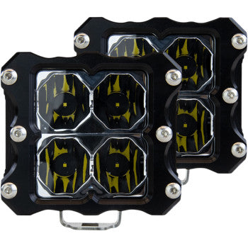 The LED Quattro Light Flood Pair by Heretic features two black, square off-road lights, each with four yellow-tinted CREE LEDs in tough aircraft-grade aluminum housings with corner screws.