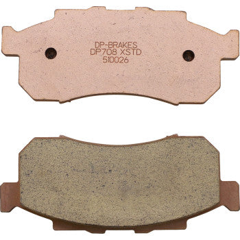Two rectangular Sintered Brake Pads by DP Brakes are shown: one with a sintered metal surface for fade-free performance and the other with a flat, engraved backing plate labeled DP-BRAKES DP708 XSTD 51026.