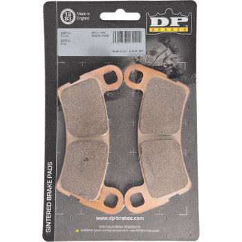 A pack of Polaris Sintered Brake Pads XD1 Rear by DP Brakes for ATVs, featuring two pairs on a black backing with product details and branding clearly displayed.