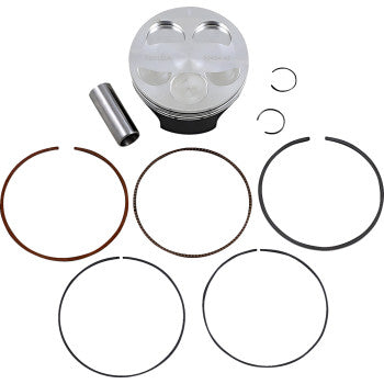 Silver metal piston with four valve reliefs and black base, accompanied by six black and brown piston rings and a small.