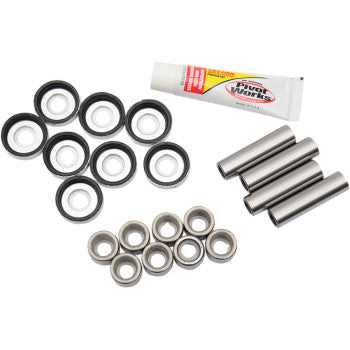 The A-Arm Bearing Kit Front Lower by Pivot Works includes needle roller bearings, metal rods, rubber seals, and Pure Works lubricant—perfect for Yamaha steering control maintenance. All items are arranged on a white background.