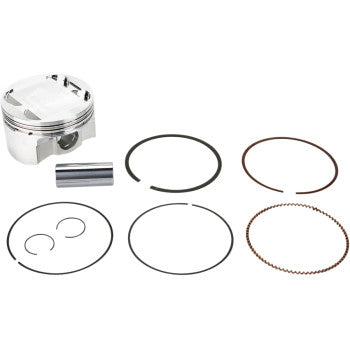 Silver metal piston with matching pins and black and bronze piston rings arranged on white background.