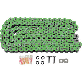 The 525 Max X Drive Chain 120 Links Green by Rk, made in Japan, features a green and silver O-ring design, high tensile strength, and includes two pins, a connecting link, four O-rings, and lubricant on a white background.