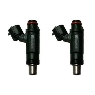 Pair of black metal remanufactured Kawasaki Teryx fuel injectors with red seals and electrical connectors.